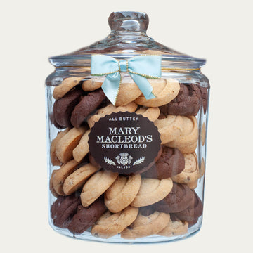 4 Quart Glass cookie jar from mary macleod's shortbread - 83 signature variety shortbread cookies inside, accented with signature ocean blue bow on jar