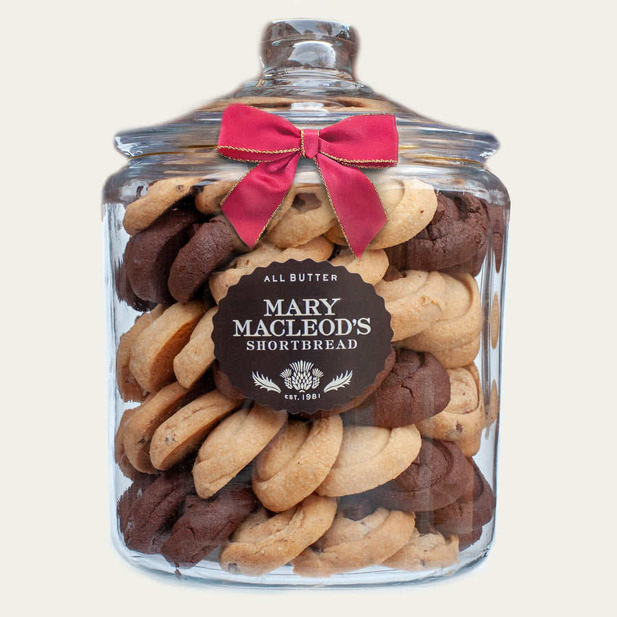 Mary Macleod's Shortbread 4-quart cookie jar filled with an assortment of all-butter shortbread cookies, including classic and chocolate flavors, tied with a red ribbon