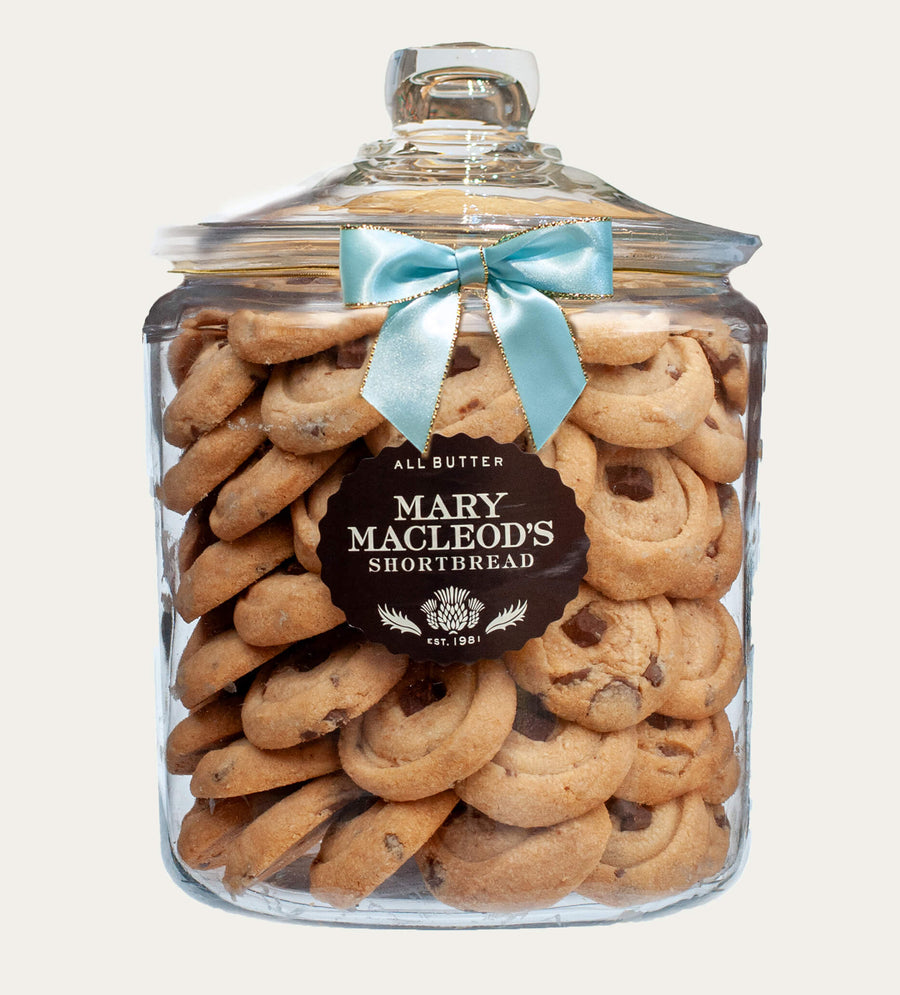 4 Quart Glass cookie jar from mary macleod's shortbread - 83 signature chocolate crunch shortbread cookies inside, accented with signature ocean blue bow on jar