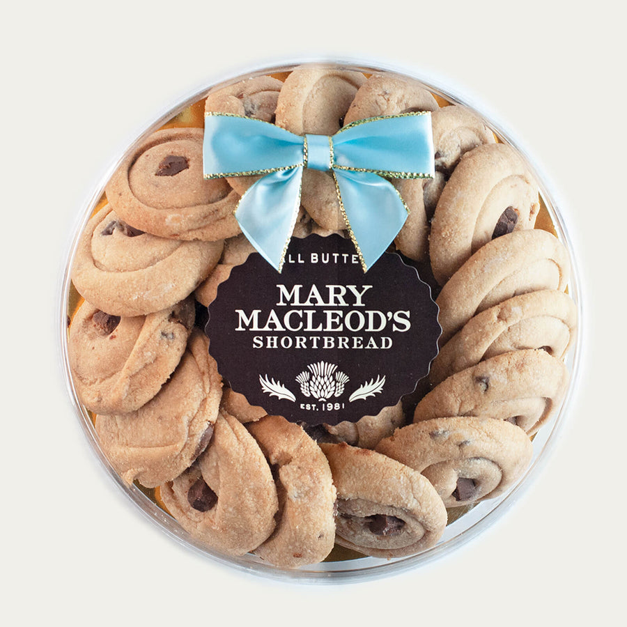 7 Inch Clear Transparent Round package of Mary Macleod's Shortbread with 21 premium artisanal gourmet signature chocolate crunch all-butter shortbread cookies, accented with our ocean tiffany blue bow