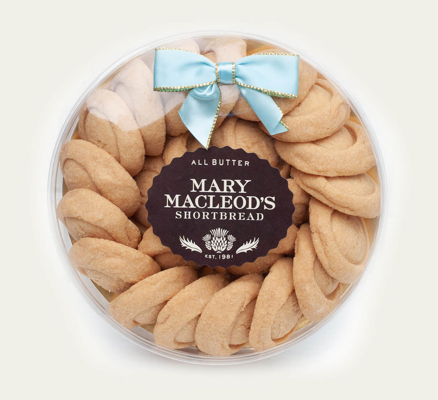 7 Inch Clear Transparent Round package of Mary Macleod's Shortbread with 21 premium artisanal classic all-butter shortbread cookies, accented with our ocean tiffany blue bow