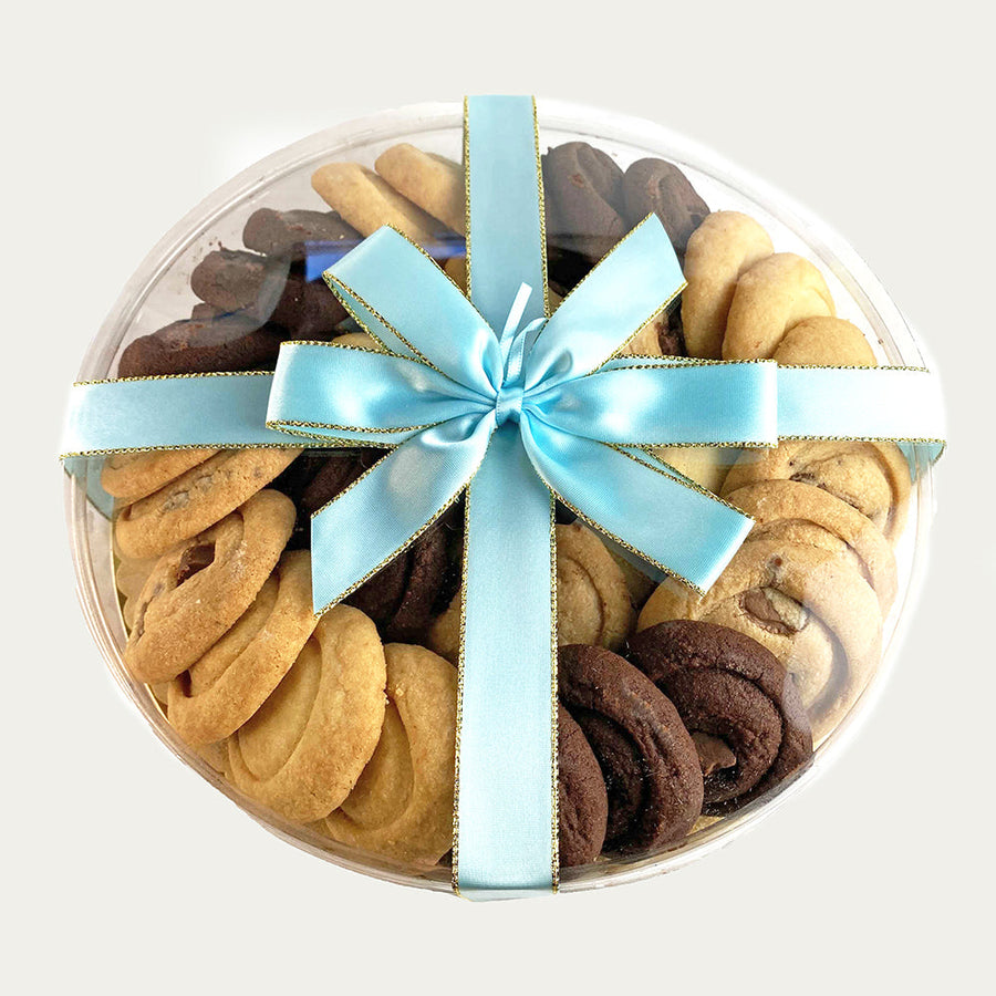 9 inch round clear gift packaging with ocean blue bow filled with handcrafted all butter assorted shortbread cookies