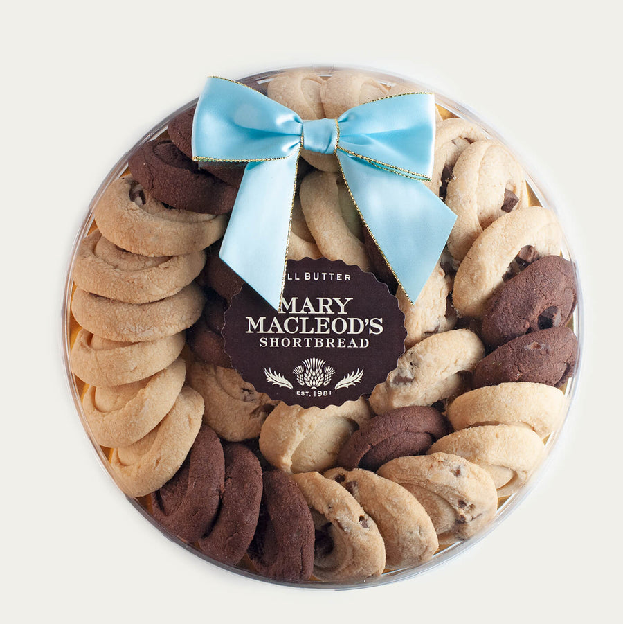 9 Inch Clear Transparent Round package of Mary Macleod's Shortbread with 36 premium artisanal gourmet signature assorted variety  all-butter shortbread cookies, accented with our tiffany ocean blue bow, premium holiday Christmas gift 