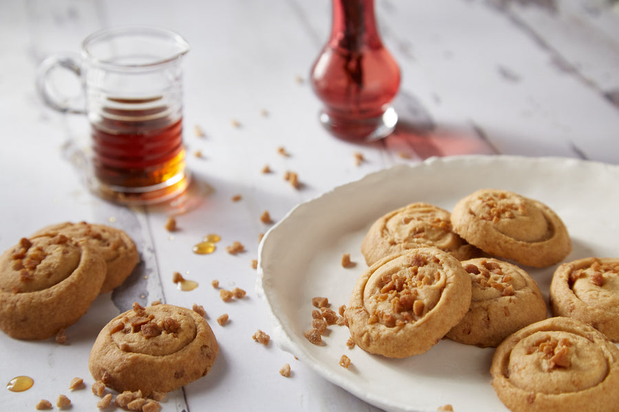 maple crunch shortbread cookies from mary macleod's shortbread, next to real quebec maple syrup. 