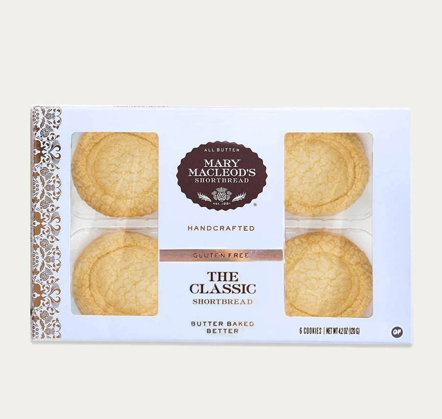 Front on view of Mary Macleod's Shortbread Window Bakery Box in Blue, of 6 Gluten-Free All-Butter Handcrafted, premium, gourmet, artisanal Classic Shortbread Cookies. Features gold embellishments. 