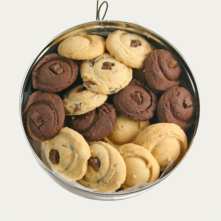 small red tin of assorted shortbread cookies.
